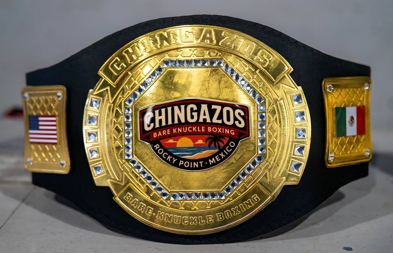 The CHINGAZOS Bare Knuckle Boxing championship belt — gold centerplate reading Rocky Point, Mexico, flanked by United States and Mexican flag side plates.